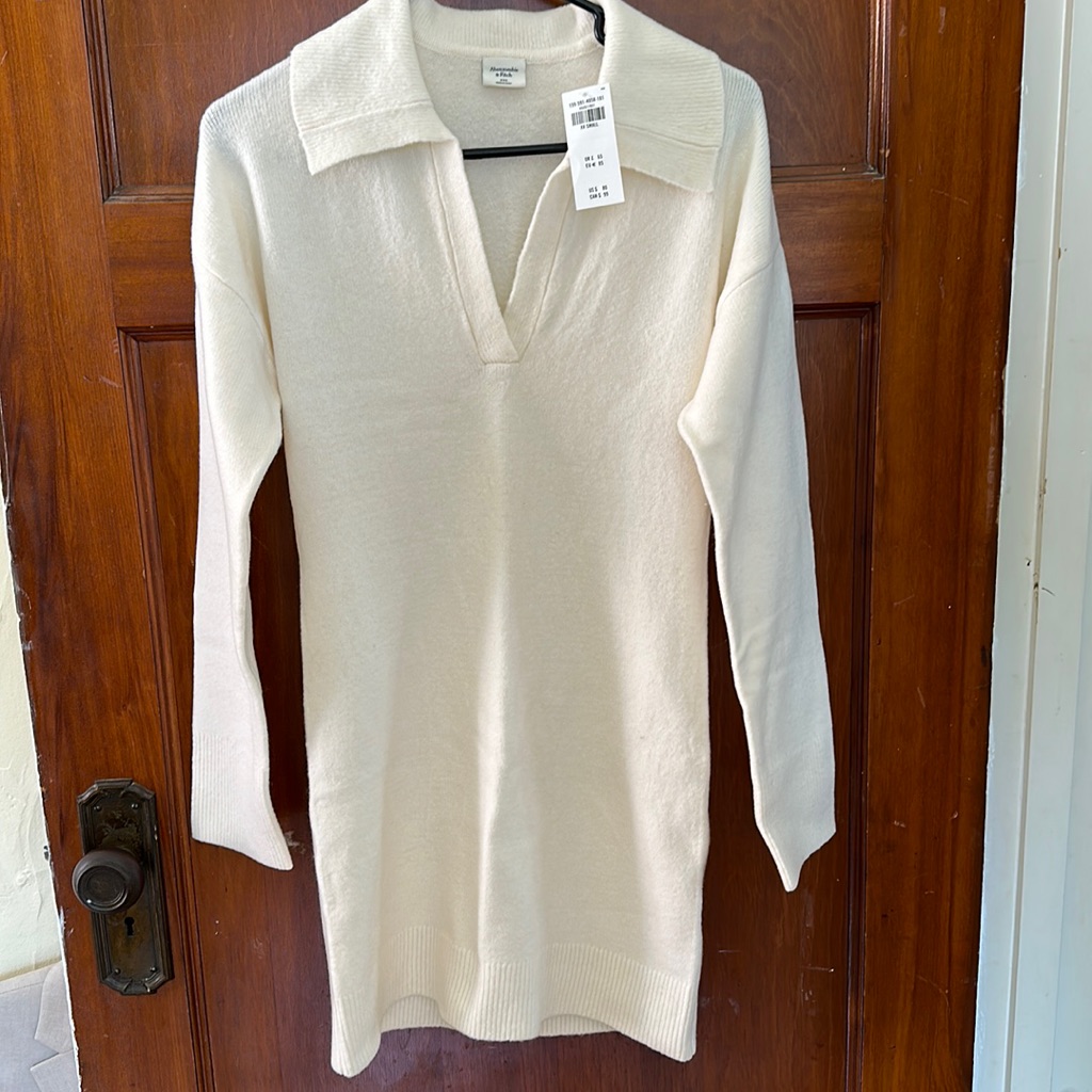 a&f sweater dress Ladies Merino Wool Short By Aran Mills Soft knit fabric Stretch fit Straight relaxed silhouette Fold over turtleneck styling Fringe asymmetric hem Pull Edited by Hunter McGrady Women's